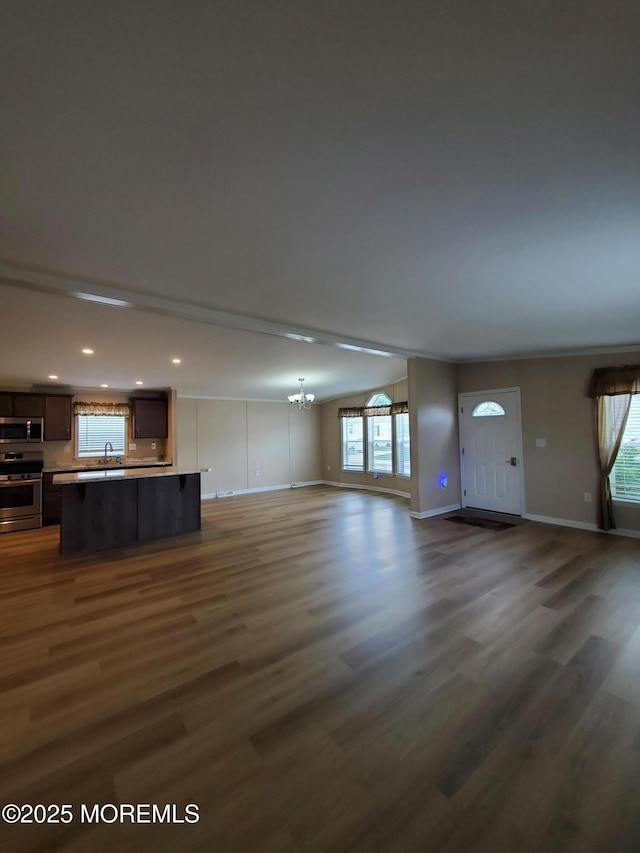 69 Robin Pl, Freehold, NJ 07728 - unfurnished living room featuring dark wood-style floors, a chandelier, and recessed lighting