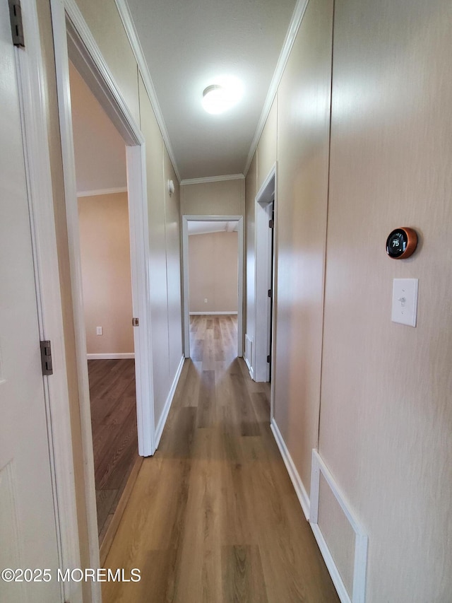 69 Robin Pl, Freehold, NJ 07728 - hallway featuring wood finished floors and crown molding