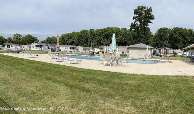 69 Robin Pl, Freehold, NJ 07728 - community pool with a yard and a patio area