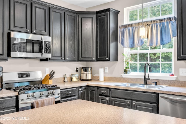 46 Timberline Rd, Bayville, NJ 08721 - kitchen with appliances with stainless steel finishes, dark cabinets, light countertops, and pendant lighting
