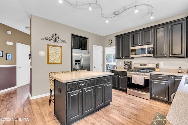 46 Timberline Rd, Bayville, NJ 08721 - kitchen with stainless steel appliances, dark cabinetry, light countertops, and light wood finished floors