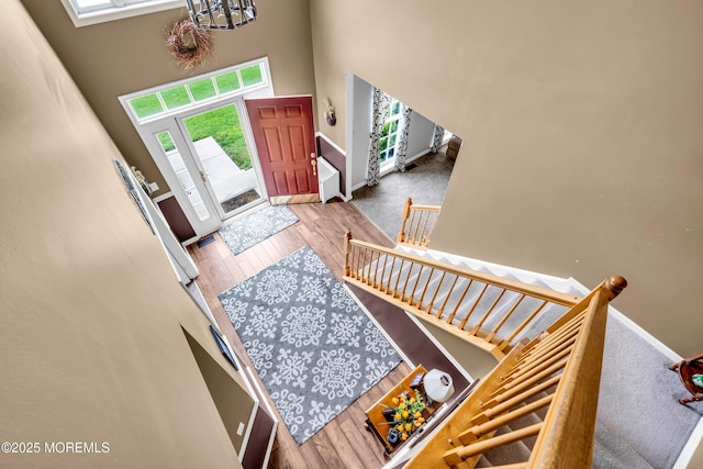 46 Timberline Rd, Bayville, NJ 08721 - foyer entrance with plenty of natural light, a towering ceiling, a chandelier, and wood finished floors