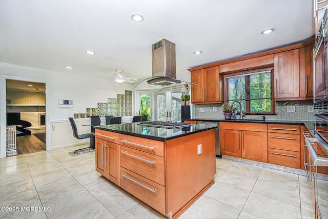 5 Leighton Dr, East Brunswick, NJ 08816 - kitchen featuring island range hood, plenty of natural light, light tile patterned flooring, recessed lighting, and crown molding