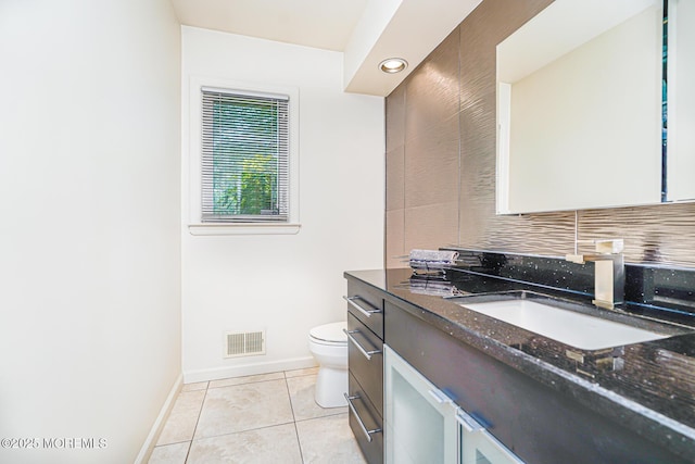 5 Leighton Dr, East Brunswick, NJ 08816 - bathroom with vanity, toilet, baseboards, tile patterned flooring, and decorative backsplash