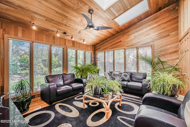 5 Leighton Dr, East Brunswick, NJ 08816 - living room with track lighting, a skylight, wooden ceiling, wood walls, and vaulted ceiling