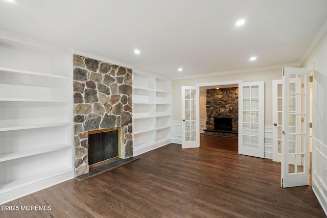 245 Borden Rd, Middletown, NJ 07748 - unfurnished living room featuring a stone fireplace, french doors, ornamental molding, wood finished floors, and built in features