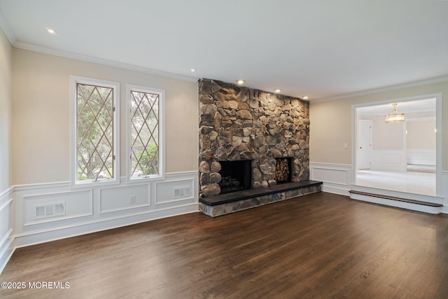 245 Borden Rd, Middletown, NJ 07748 - unfurnished living room with a baseboard heating unit, crown molding, wood finished floors, a wainscoted wall, and a fireplace
