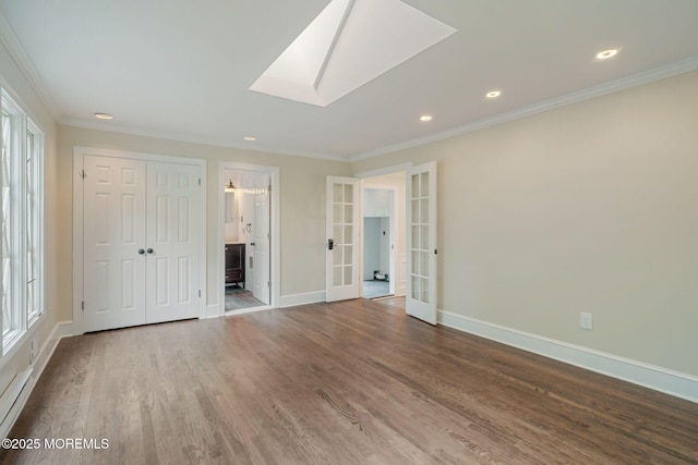 245 Borden Rd, Middletown, NJ 07748 - unfurnished bedroom with french doors, a skylight, crown molding, wood finished floors, and baseboards