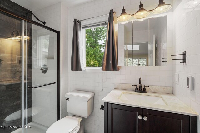 245 Borden Rd, Middletown, NJ 07748 - full bathroom featuring toilet, vanity, tile walls, a stall shower, and tasteful backsplash