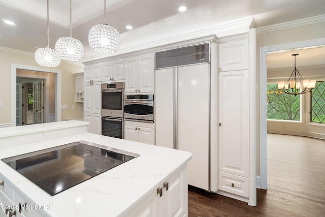 245 Borden Rd, Middletown, NJ 07748 - kitchen with a chandelier, paneled built in refrigerator, stainless steel double oven, black electric stovetop, and ornamental molding