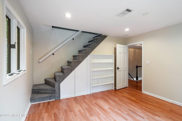 245 Borden Rd, Middletown, NJ 07748 - staircase with wood finished floors, baseboards, and recessed lighting