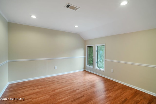 245 Borden Rd, Middletown, NJ 07748 - empty room with baseboards, vaulted ceiling, recessed lighting, light wood finished floors, and ornamental molding