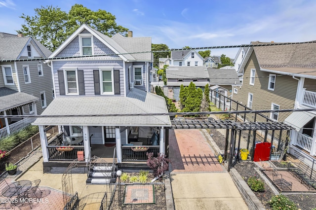 404 Park Place Ave, Bradley Beach, NJ 07720 - view of front of property with a patio, a residential view, and a shingled roof