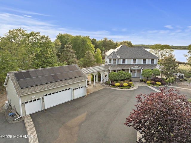 1413 Gully Rd, Wall, NJ 07719 - view of front of property with roof with shingles, solar panels, and a detached garage