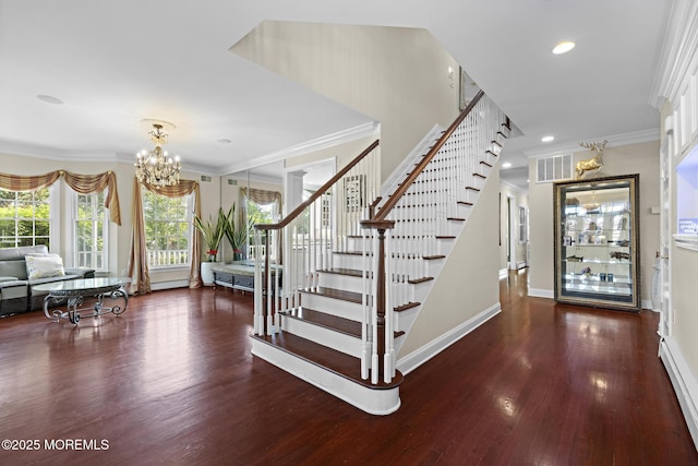 1413 Gully Rd, Wall, NJ 07719 - foyer entrance with stairs, wood finished floors, a chandelier, a baseboard heating unit, and ornamental molding