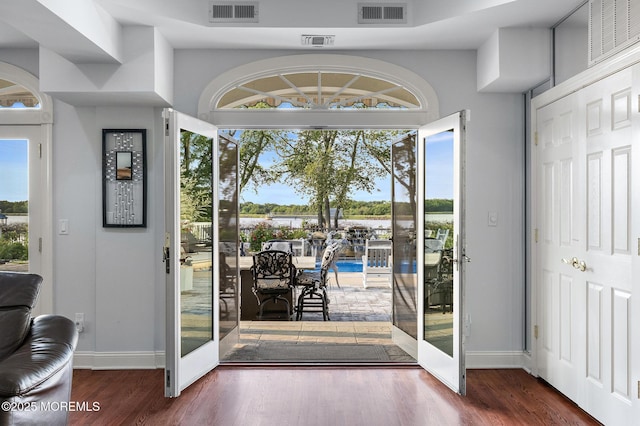 1413 Gully Rd, Wall, NJ 07719 - entryway featuring baseboards, wood finished floors, and a water view