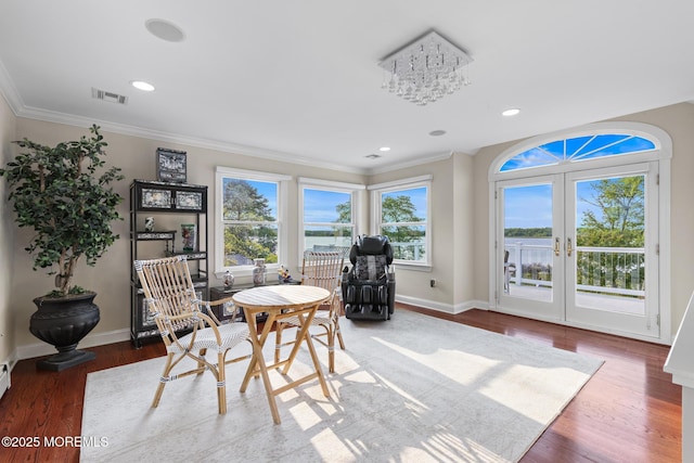 1413 Gully Rd, Wall, NJ 07719 - dining room with ornamental molding, wood finished floors, recessed lighting, baseboards, and french doors