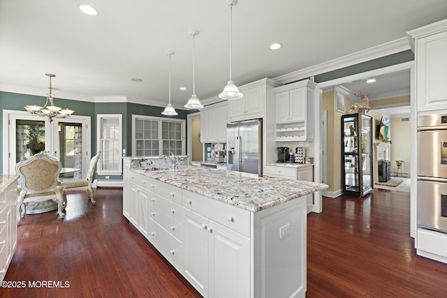 1413 Gully Rd, Wall, NJ 07719 - kitchen with stainless steel appliances, a chandelier, white cabinets, dark wood-type flooring, and a center island