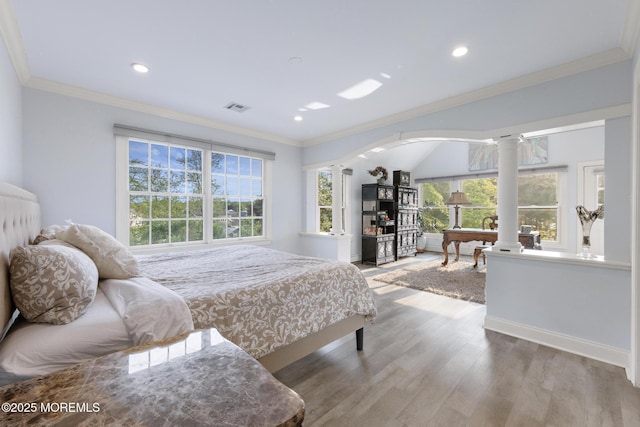 1413 Gully Rd, Wall, NJ 07719 - bedroom with decorative columns, wood finished floors, ornamental molding, recessed lighting, and arched walkways