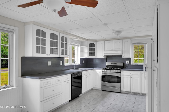 105 Cedar Grove Rd, Toms River, NJ 08753 - kitchen with black dishwasher, gas stove, under cabinet range hood, dark countertops, and a drop ceiling
