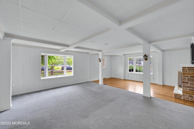 105 Cedar Grove Rd, Toms River, NJ 08753 - unfurnished living room with carpet flooring, beam ceiling, wood finished floors, and a brick fireplace