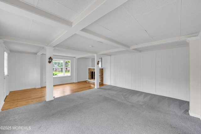 105 Cedar Grove Rd, Toms River, NJ 08753 - unfurnished living room featuring carpet flooring, beamed ceiling, and a fireplace