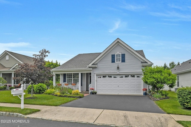 21 Blyth Ln, Jackson, NJ 08527 - traditional home featuring asphalt driveway, a front yard, and covered porch