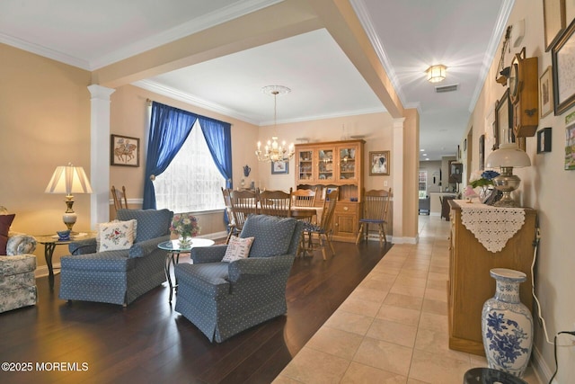 21 Blyth Ln, Jackson, NJ 08527 - living room with ornate columns, wood finished floors, crown molding, baseboards, and a chandelier