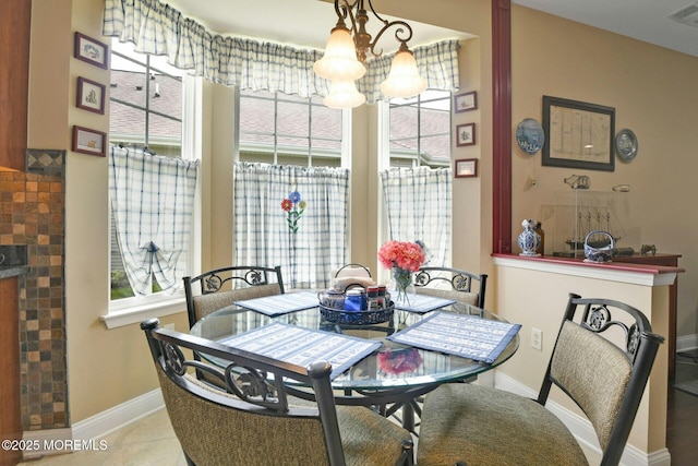 21 Blyth Ln, Jackson, NJ 08527 - dining space with a chandelier, baseboards, and a fireplace