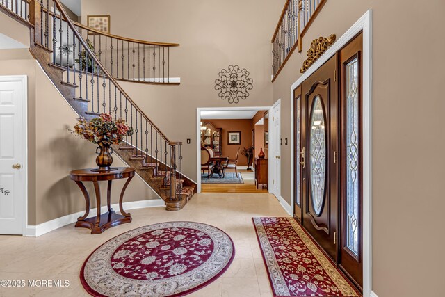 10 Cheryl Ln, Millstone, NJ 08510 - tiled entrance foyer featuring a towering ceiling, stairway, healthy amount of natural light, and inlaid floor details