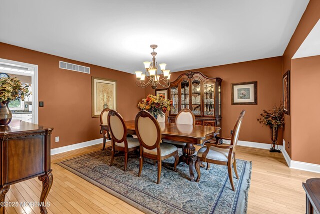 10 Cheryl Ln, Millstone, NJ 08510 - dining area with a chandelier and light wood finished floors