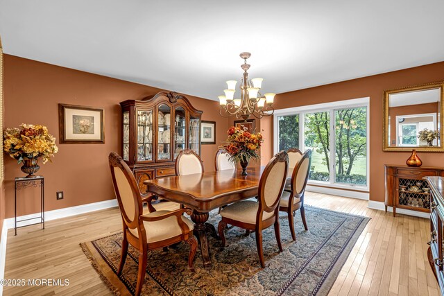 10 Cheryl Ln, Millstone, NJ 08510 - dining area featuring a chandelier and light wood-type flooring