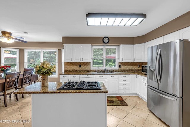 10 Cheryl Ln, Millstone, NJ 08510 - kitchen featuring appliances with stainless steel finishes, light tile patterned floors, and white cabinetry