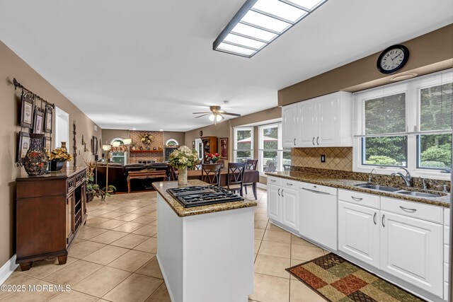 10 Cheryl Ln, Millstone, NJ 08510 - kitchen with white dishwasher, black gas cooktop, a center island, tasteful backsplash, and light tile patterned floors
