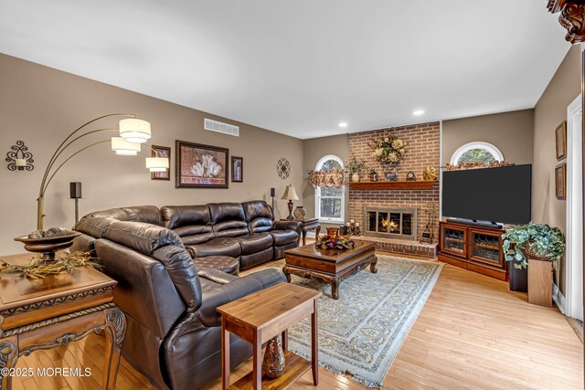 10 Cheryl Ln, Millstone, NJ 08510 - living room with light wood-style floors, recessed lighting, and a brick fireplace