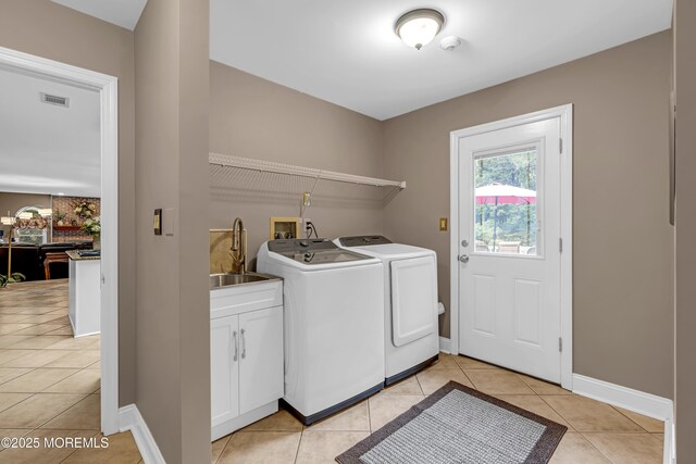10 Cheryl Ln, Millstone, NJ 08510 - washroom featuring washer and dryer, light tile patterned floors, and cabinet space