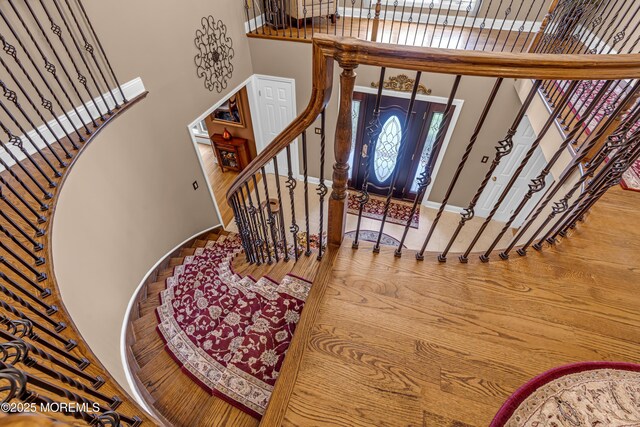10 Cheryl Ln, Millstone, NJ 08510 - foyer featuring a towering ceiling, stairs, and wood finished floors