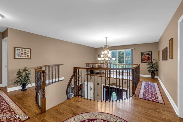 10 Cheryl Ln, Millstone, NJ 08510 - staircase with wood finished floors and a chandelier