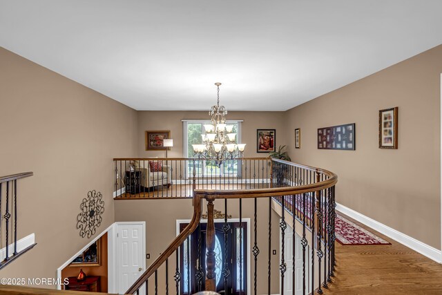 10 Cheryl Ln, Millstone, NJ 08510 - stairs featuring a chandelier and wood finished floors