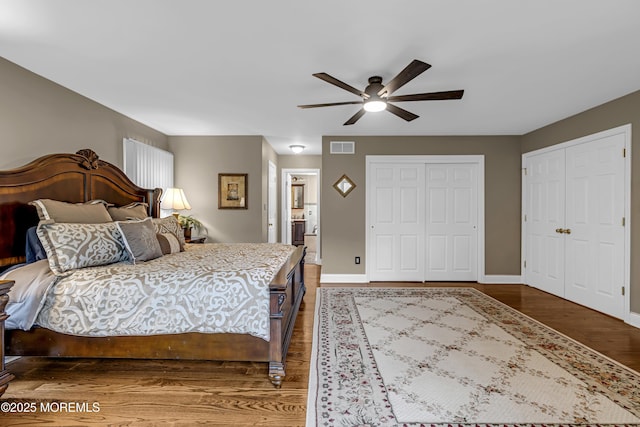 10 Cheryl Ln, Millstone, NJ 08510 - bedroom featuring wood finished floors, two closets, ensuite bathroom, and ceiling fan