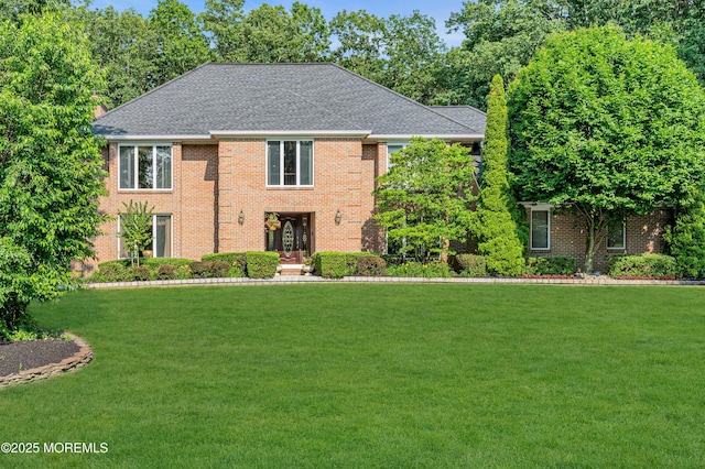 10 Cheryl Ln, Millstone, NJ 08510 - view of front facade featuring a front lawn, brick siding, and roof with shingles