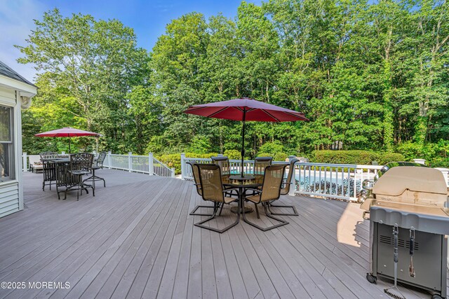 10 Cheryl Ln, Millstone, NJ 08510 - wooden deck featuring outdoor dining space, a grill, and view of wooded area