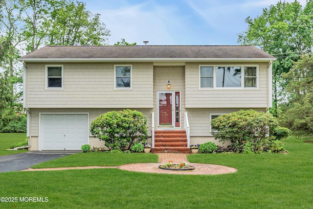 136 Iron Ore Rd, Manalapan, NJ 07726 - bi-level home with a front yard, driveway, a garage, and roof with shingles
