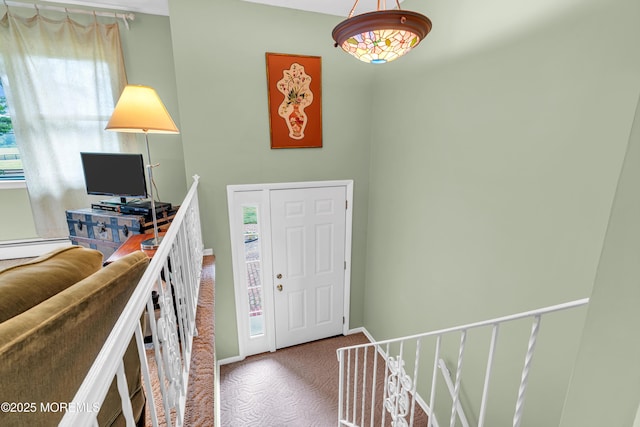 136 Iron Ore Rd, Manalapan, NJ 07726 - foyer entrance with carpet floors and baseboard heating