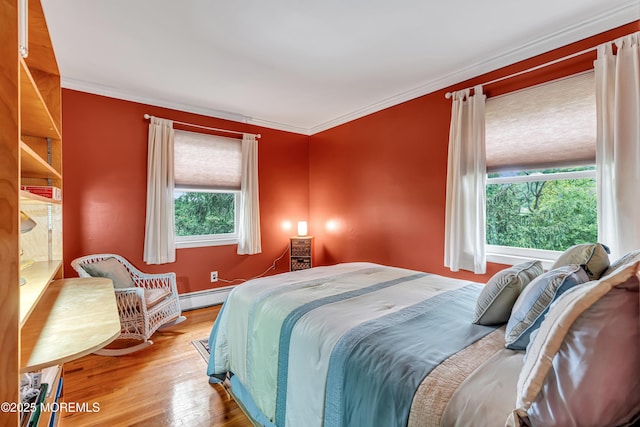 136 Iron Ore Rd, Manalapan, NJ 07726 - bedroom with a baseboard radiator, wood finished floors, and crown molding