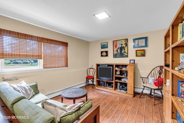 136 Iron Ore Rd, Manalapan, NJ 07726 - living room with baseboard heating and wood finished floors
