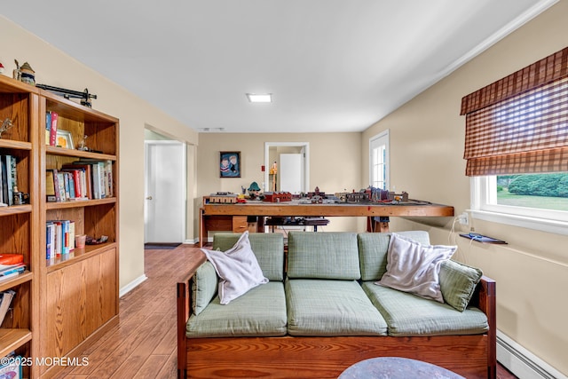 136 Iron Ore Rd, Manalapan, NJ 07726 - living area featuring a baseboard radiator and wood finished floors