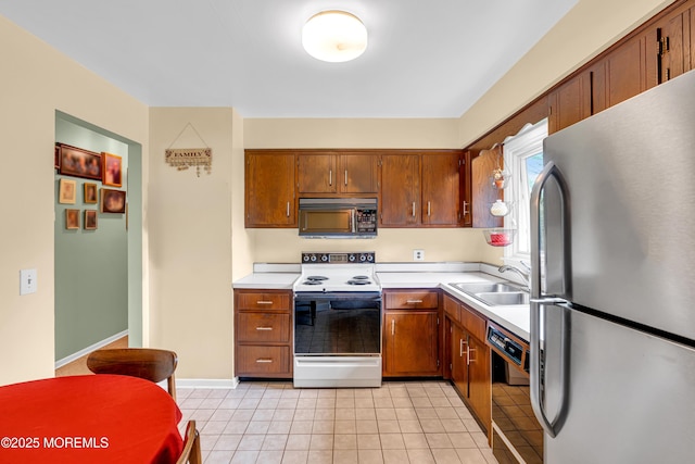 136 Iron Ore Rd, Manalapan, NJ 07726 - kitchen featuring freestanding refrigerator, electric range, black dishwasher, and light countertops