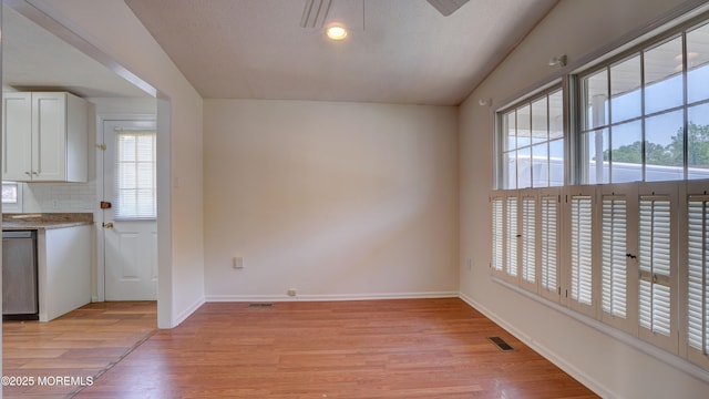 21 Parkview Way, Manalapan, NJ 07726 - unfurnished dining area featuring light wood-style floors and recessed lighting