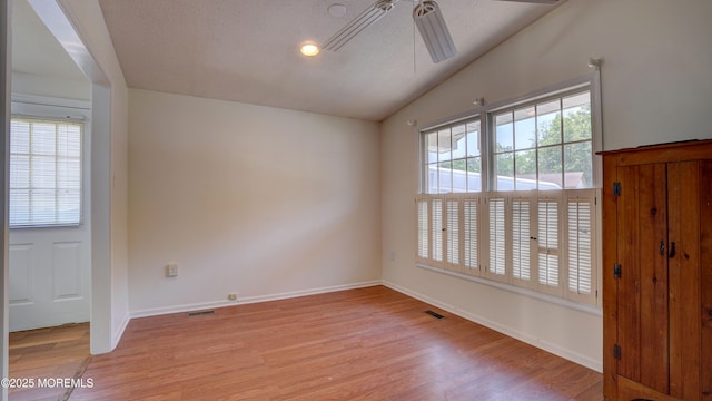 21 Parkview Way, Manalapan, NJ 07726 - unfurnished room featuring vaulted ceiling, light wood finished floors, and a ceiling fan